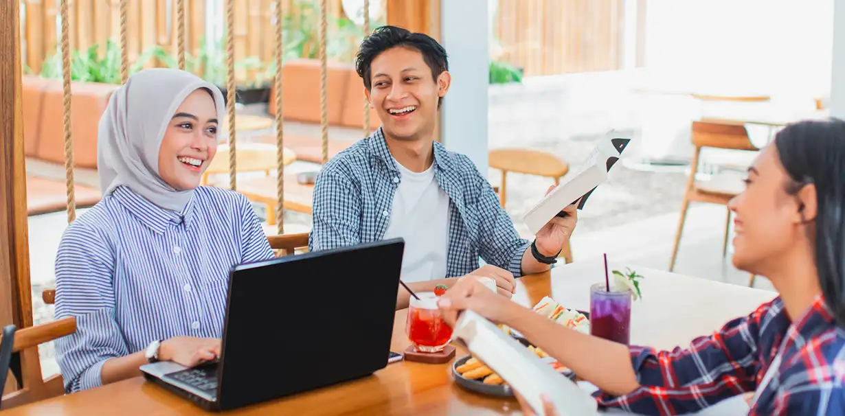 three-friends-university-students-learn-together-joke-coffee-shop 1